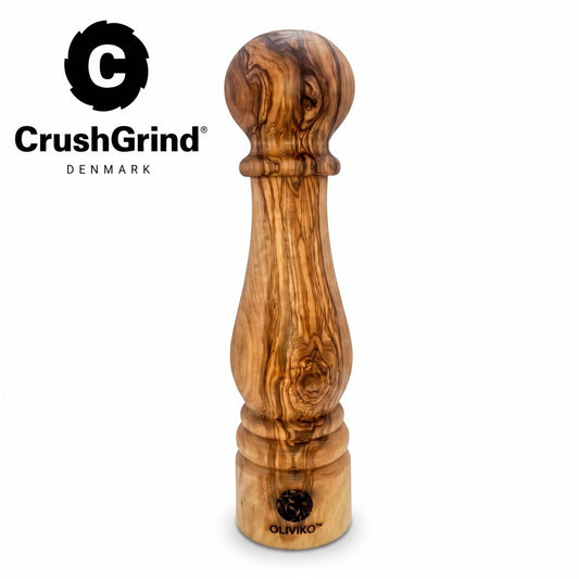 A wooden CrushGrind pepper mill with a polished olive wood grain pattern, shown on a white background with the CrushGrind logo in the top-left corner.