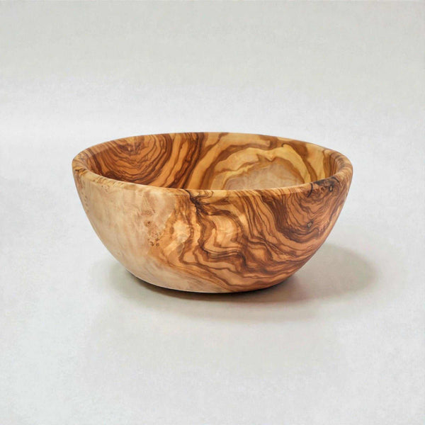 Handcrafted OLIVIKO Olive Wood Bowl with natural grain patterns, perfect for serving salads and snacks